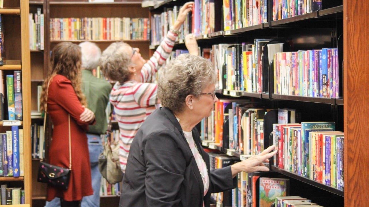 friends-bookstore-browsing-feature Customers shopping at the Friends Bookstore in the Florence-Lauderdale Public Library