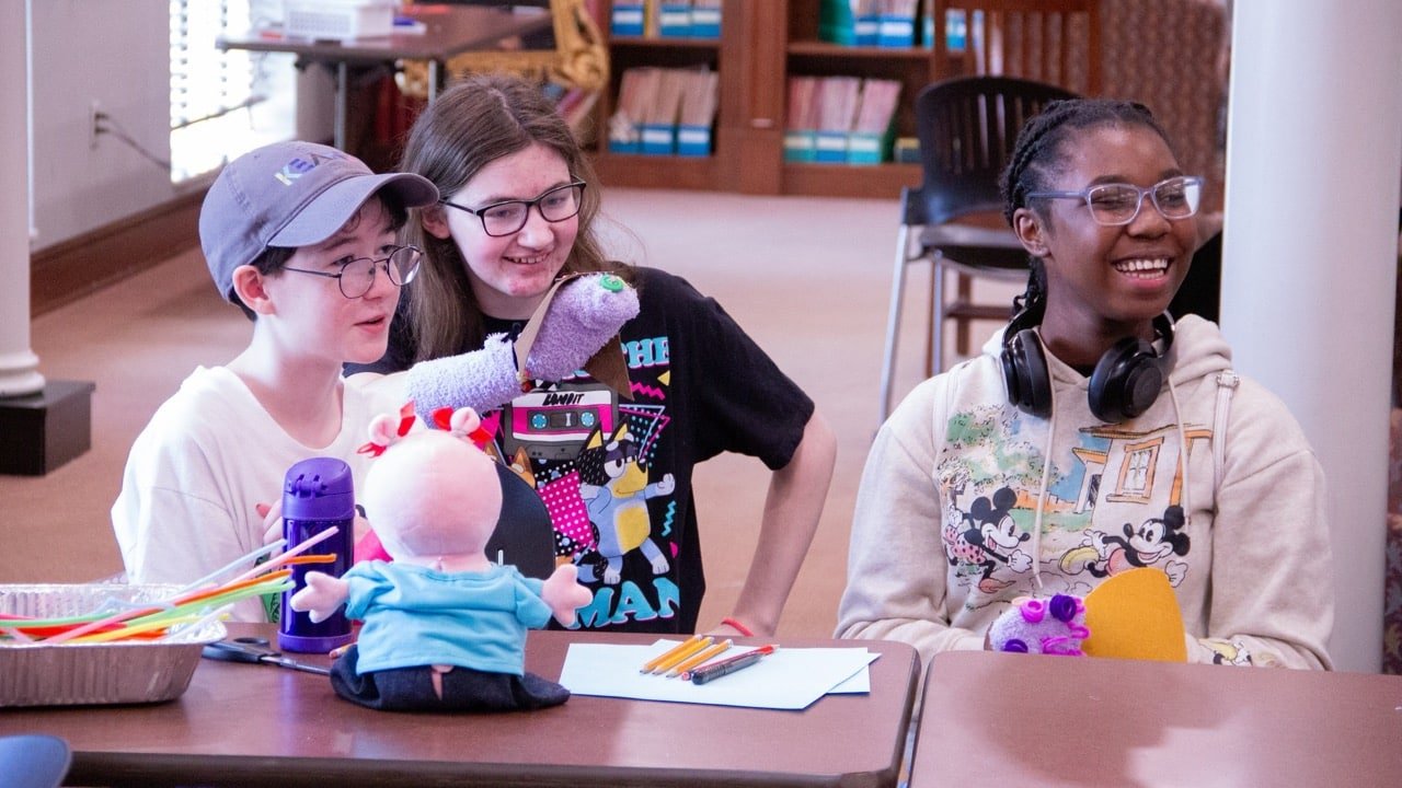 Teens at a puppet-making events at the Florence-Lauderdale Public Library